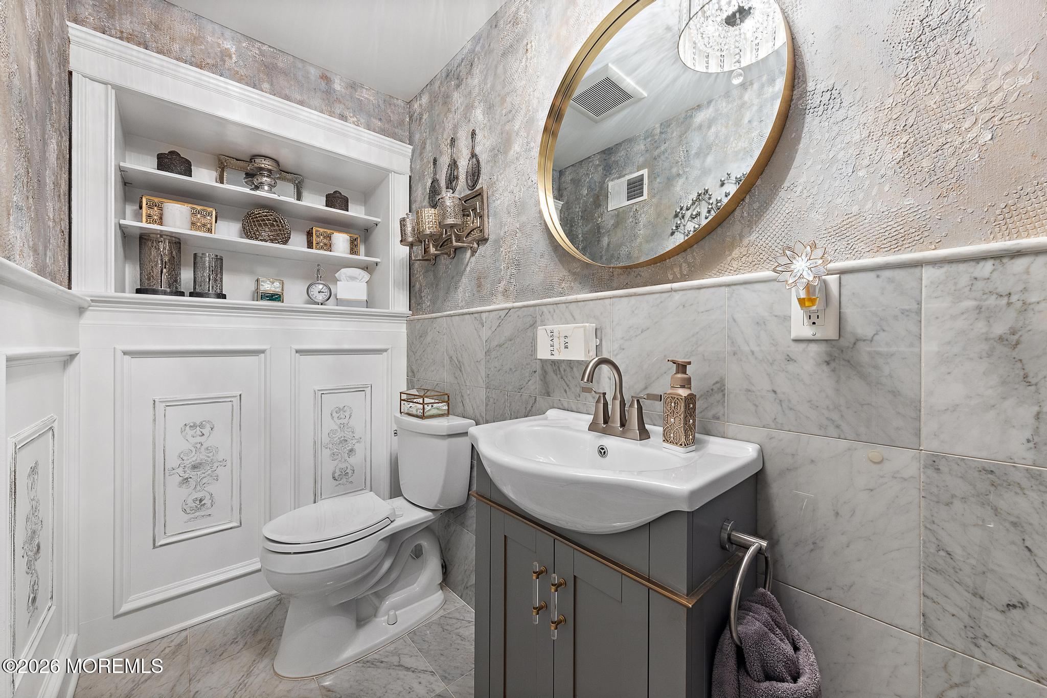 57 Beaver Dam Road Colts Neck, NJ 07722 - Photo 27 of 79 a bathroom with a sink a toilet and a mirror