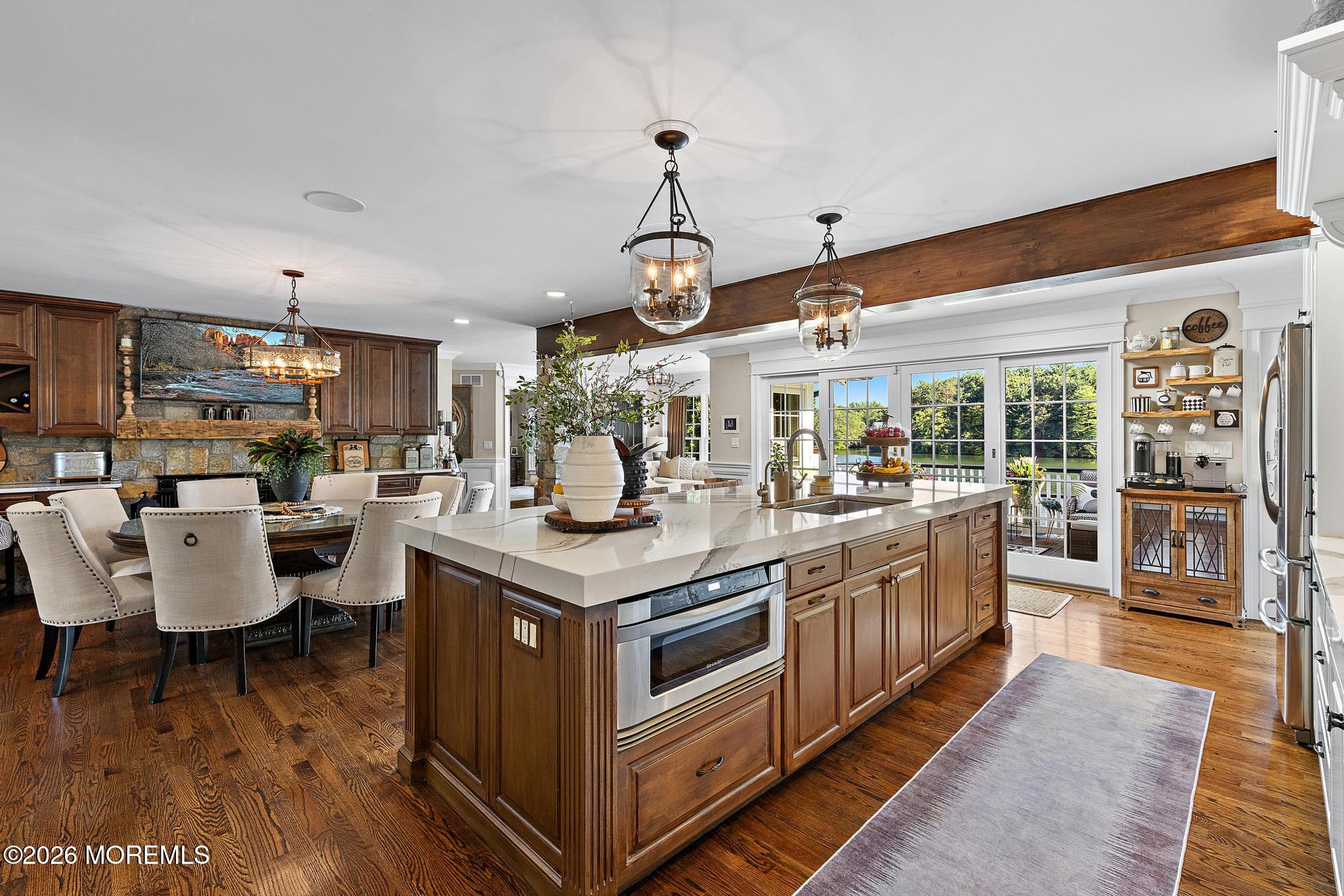 57 Beaver Dam Road Colts Neck, NJ 07722 - Photo 28 of 79 a kitchen with lots of counter and chairs
