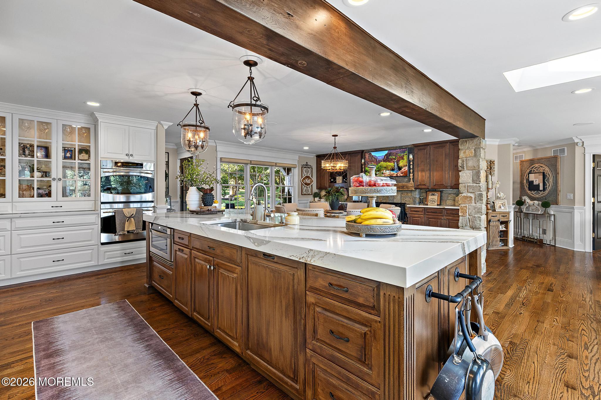 57 Beaver Dam Road Colts Neck, NJ 07722 - Photo 29 of 79 a kitchen with stainless steel appliances kitchen island granite countertop a sink and cabinets