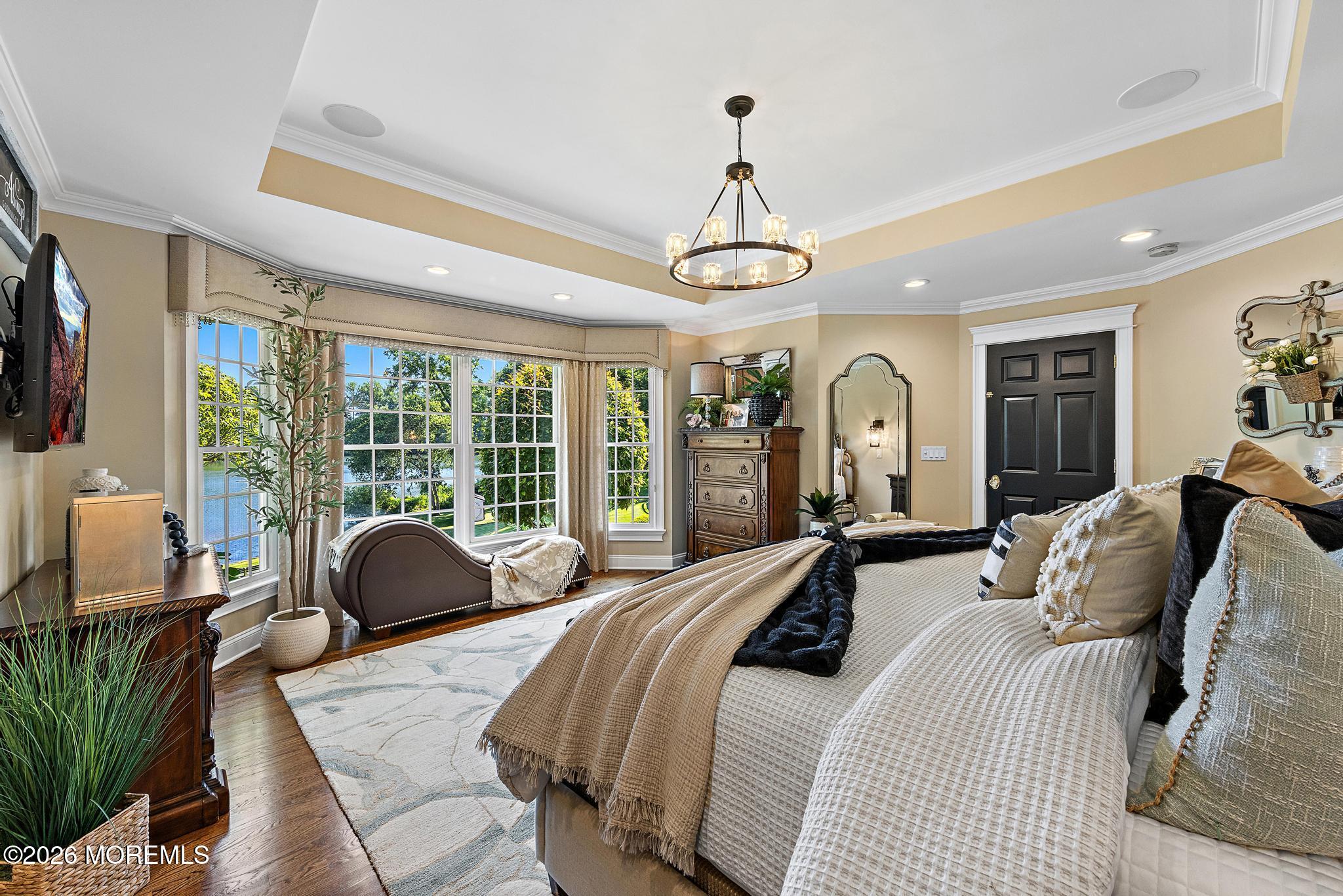 57 Beaver Dam Road Colts Neck, NJ 07722 - Photo 34 of 79 a bed room with a bed and a chandelier