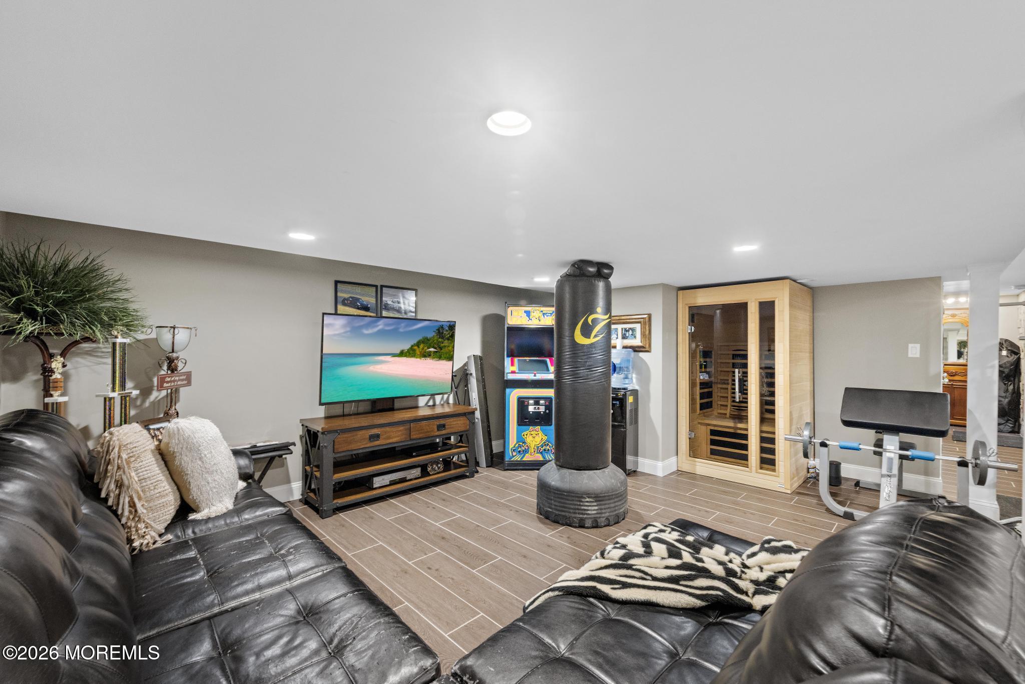 57 Beaver Dam Road Colts Neck, NJ 07722 - Photo 40 of 79 a living room with furniture and a flat screen tv