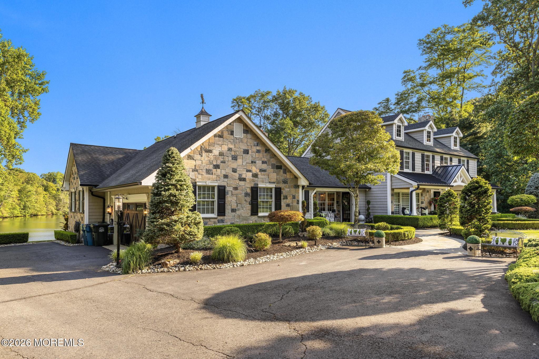 57 Beaver Dam Road Colts Neck, NJ 07722 - Photo 4 of 79 a front view of a house with a yard