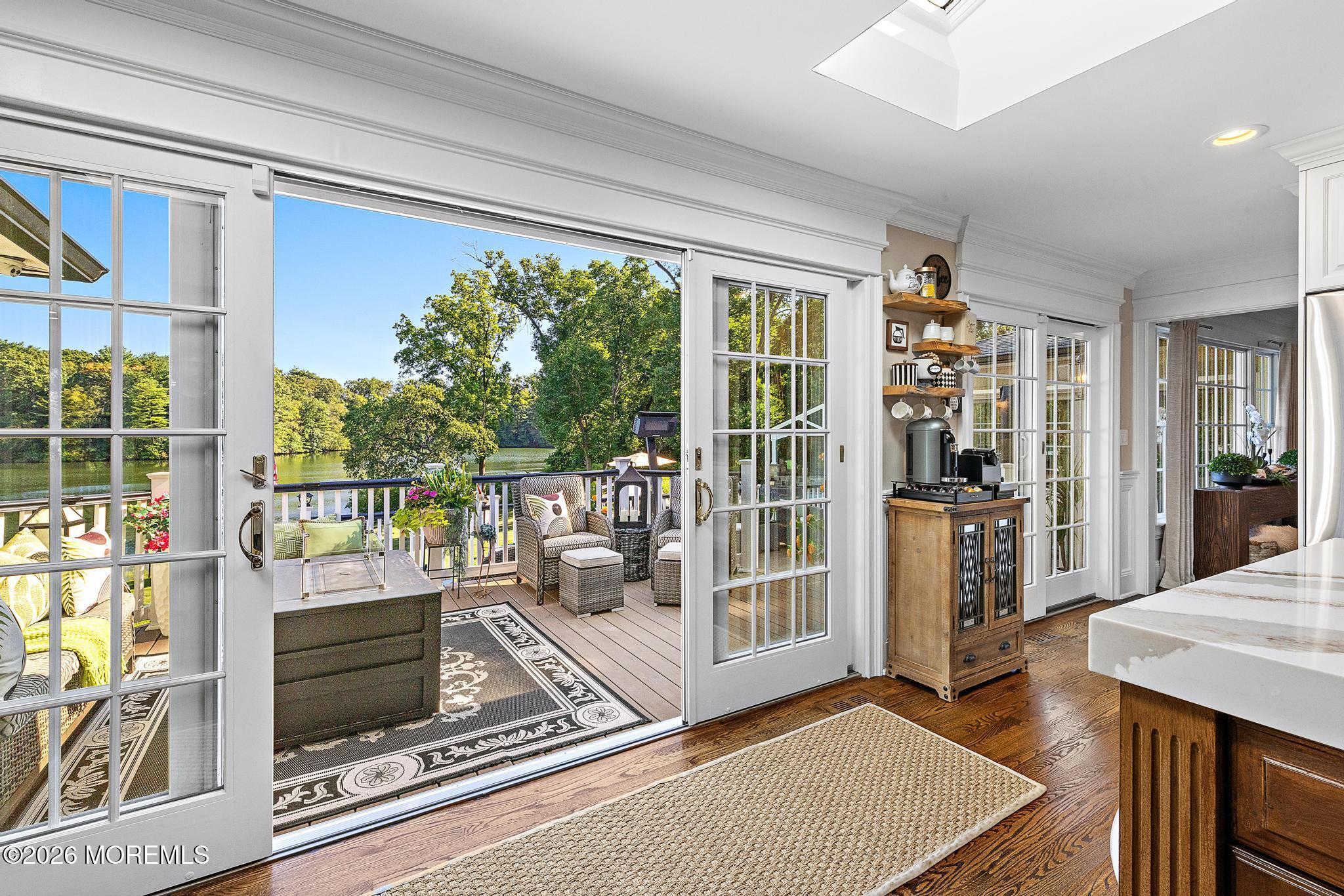 57 Beaver Dam Road Colts Neck, NJ 07722 - Photo 42 of 79 a living room with a fireplace furniture and a floor to ceiling window