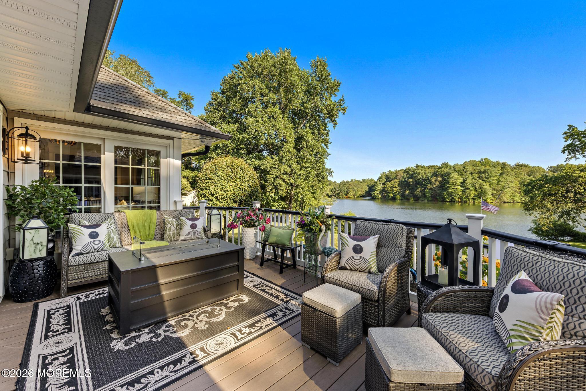 57 Beaver Dam Road Colts Neck, NJ 07722 - Photo 43 of 79 a view of a patio with couches table and chairs and potted plants