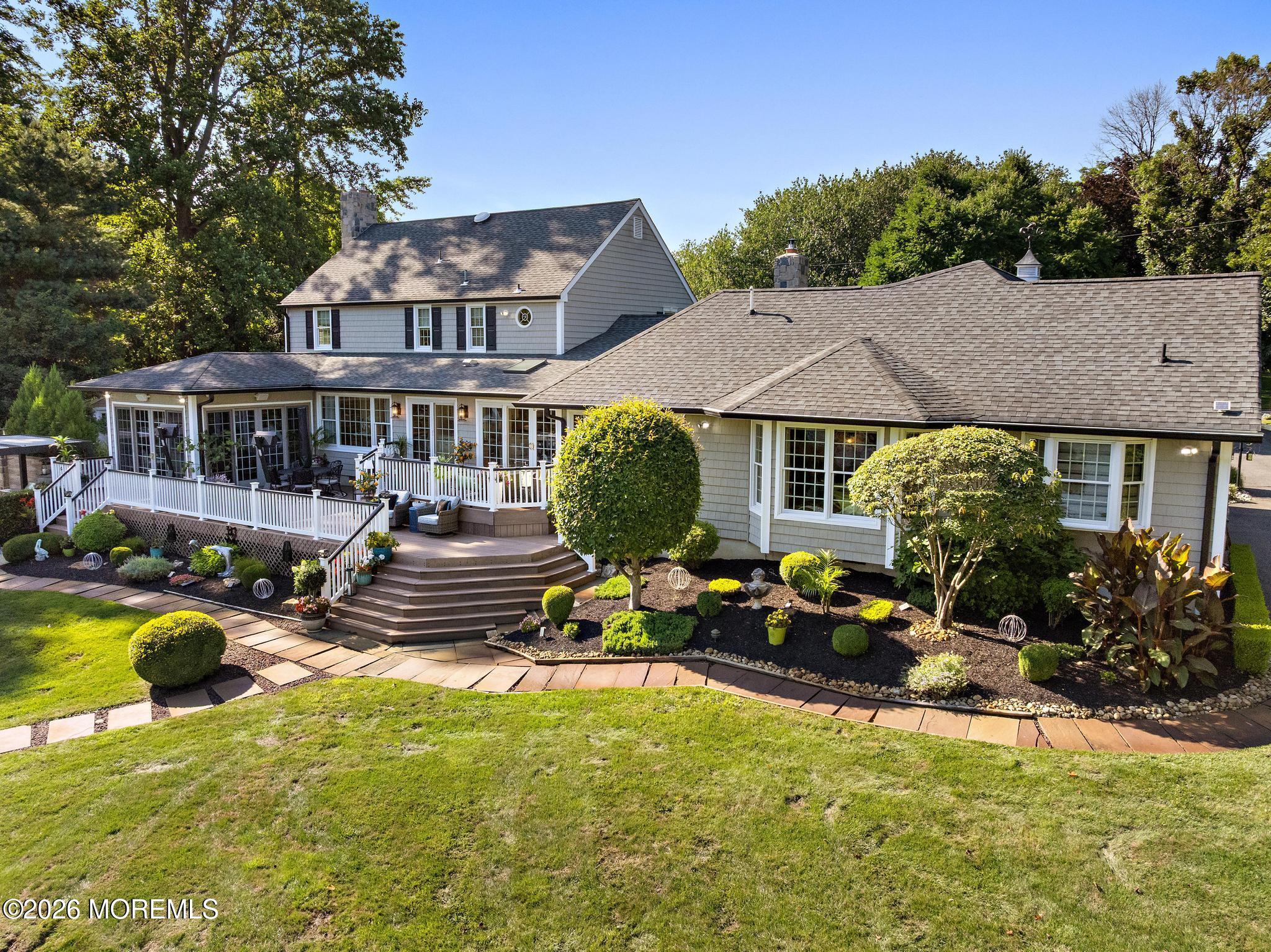 57 Beaver Dam Road Colts Neck, NJ 07722 - Photo 45 of 79 a view of a house with swimming pool and sitting area