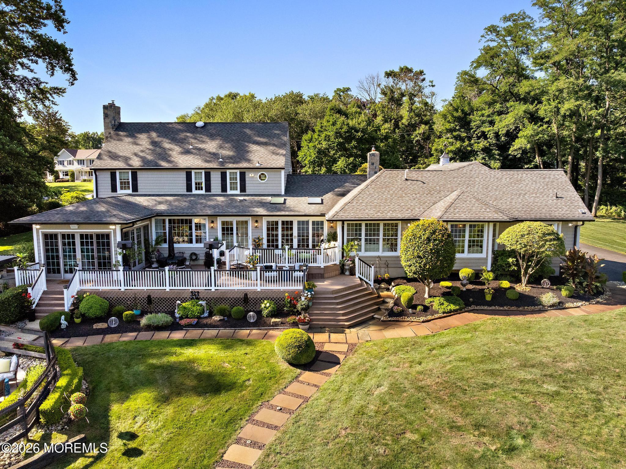57 Beaver Dam Road Colts Neck, NJ 07722 - Photo 46 of 79 a front view of a house with swimming pool and porch