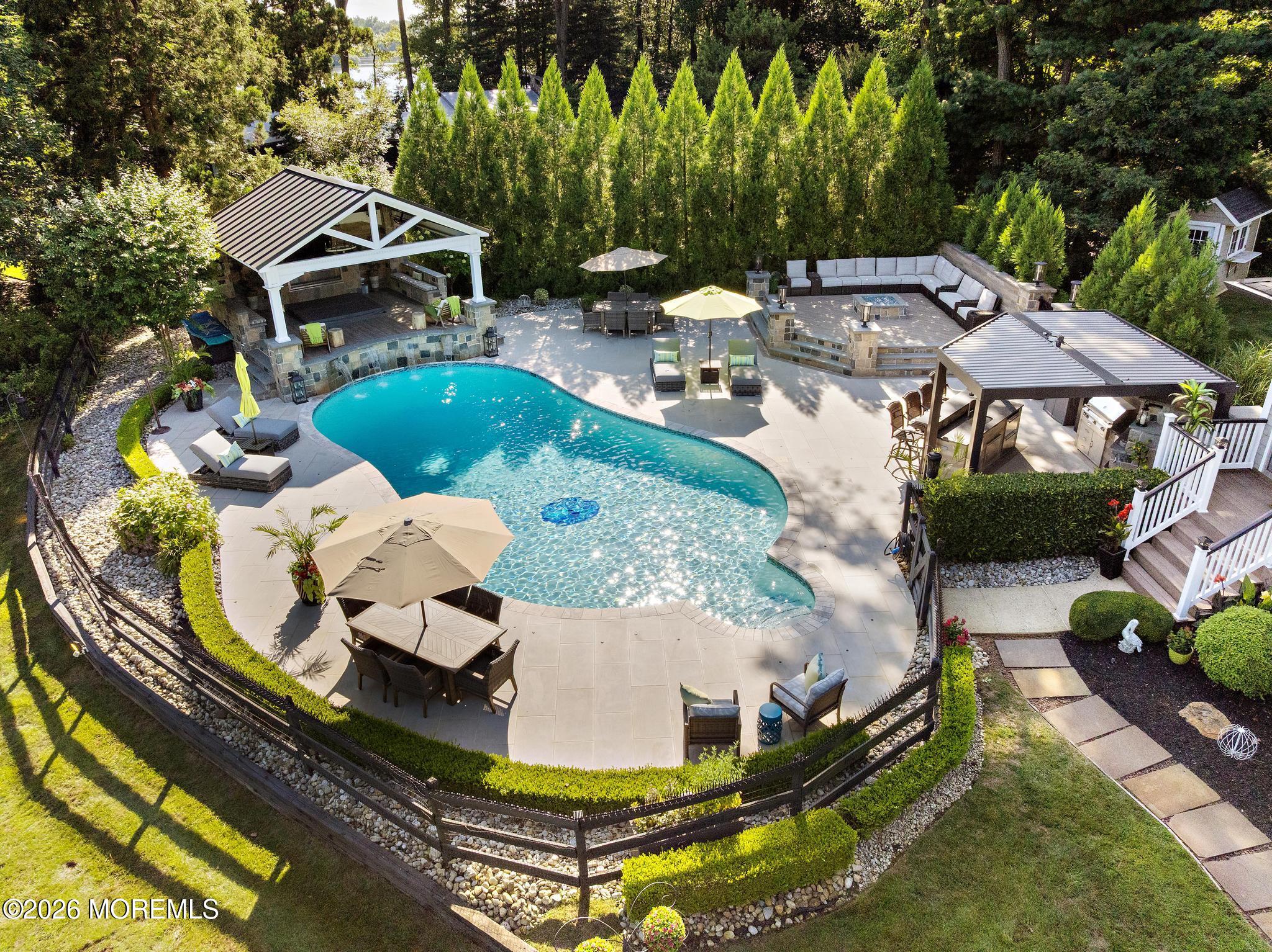 57 Beaver Dam Road Colts Neck, NJ 07722 - Photo 48 of 79 a view of a swimming pool with sitting area