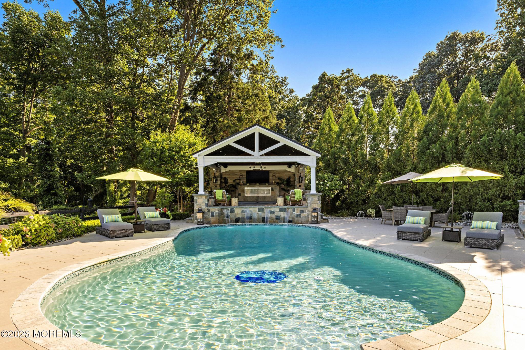 57 Beaver Dam Road Colts Neck, NJ 07722 - Photo 58 of 79 a swimming pool with outdoor seating yard and barbeque oven