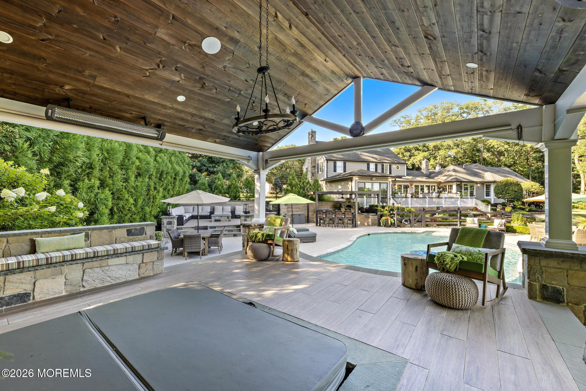 57 Beaver Dam Road Colts Neck, NJ 07722 - Photo 60 of 79 a view of a patio with table and chairs potted plants with wooden floor