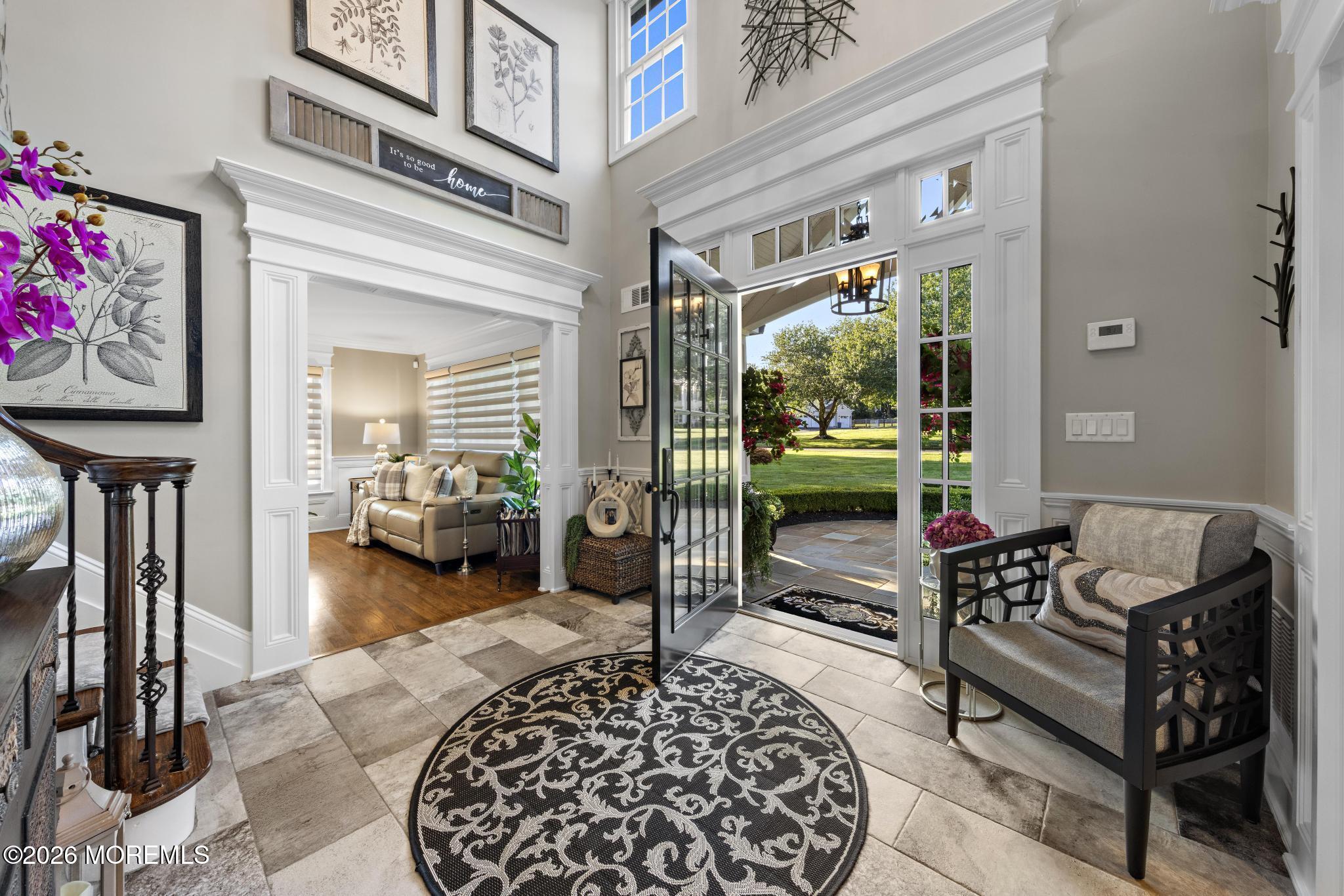 57 Beaver Dam Road Colts Neck, NJ 07722 - Photo 6 of 79 a balcony view with a couch and table chair