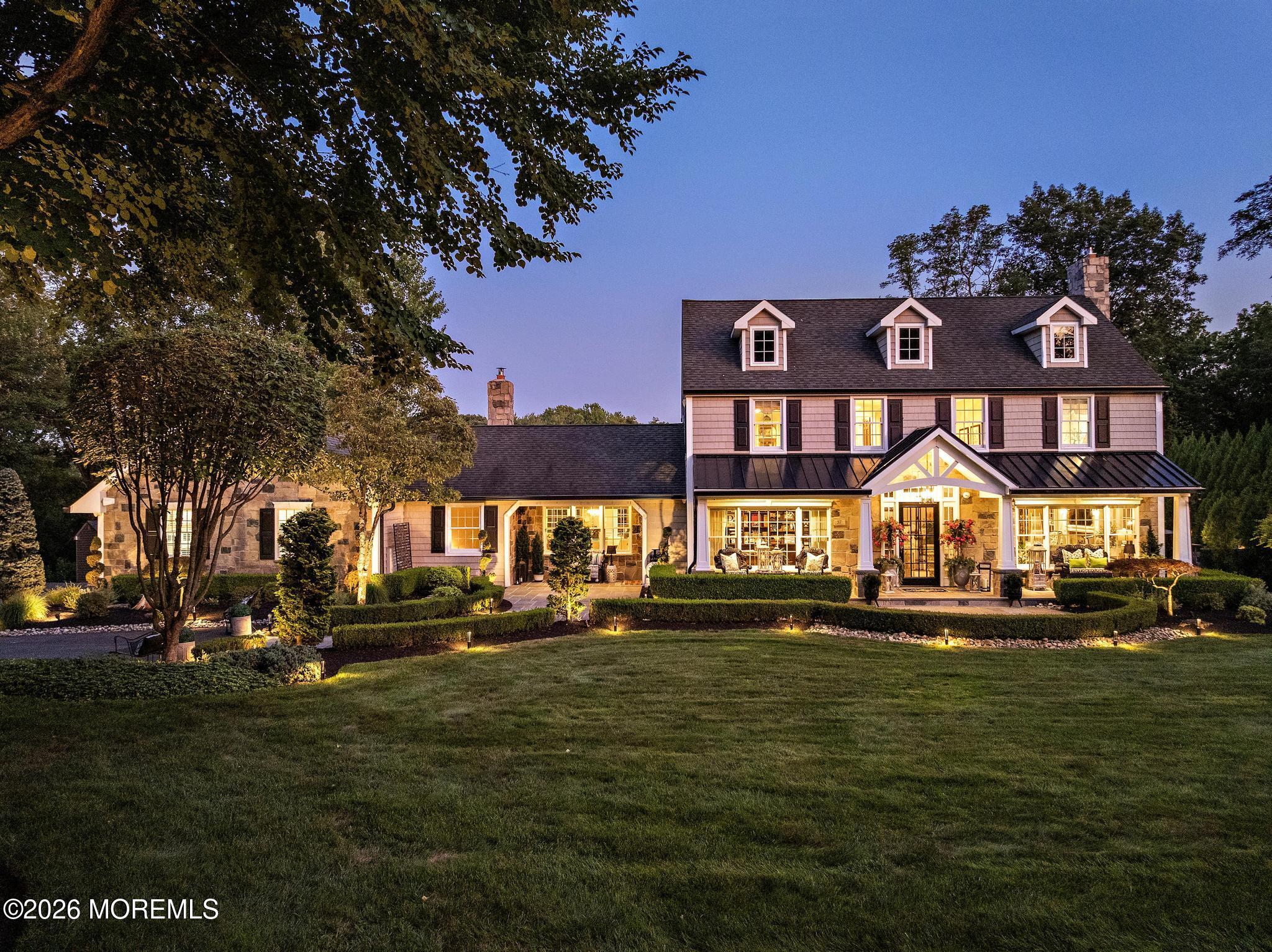 57 Beaver Dam Road Colts Neck, NJ 07722 - Photo 69 of 79 a front view of a house with a garden