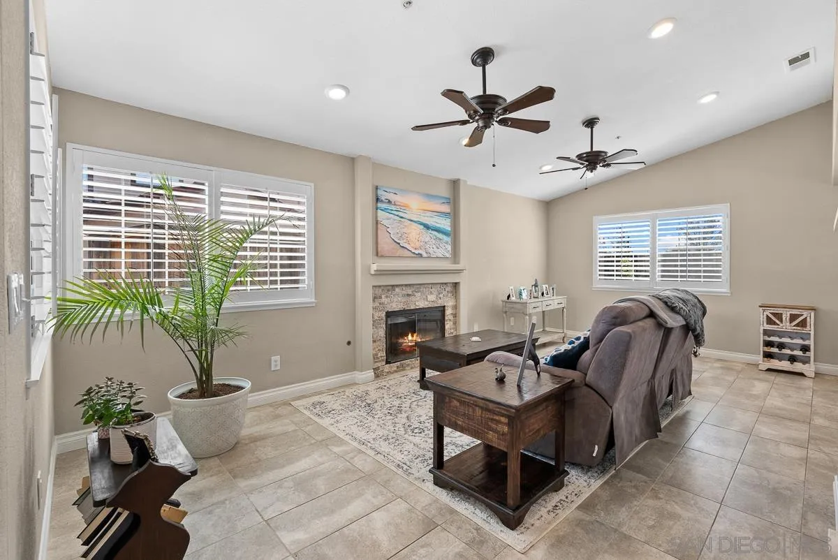 10109 Country Scenes Court Santee, CA 92071 - Photo 15 of 43 a living room with furniture floor to ceiling window and wooden floor