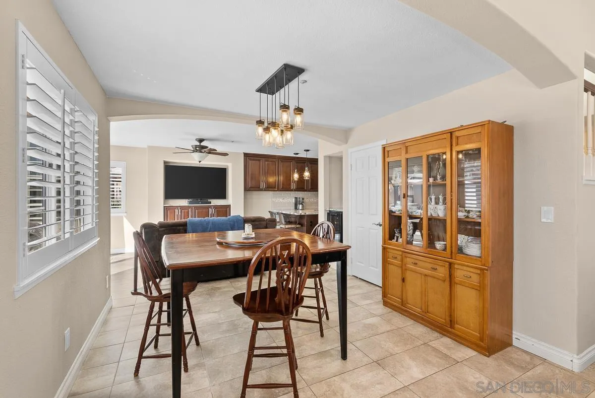10109 Country Scenes Court Santee, CA 92071 - Photo 18 of 43 a view of a dining room with furniture window and wooden floor