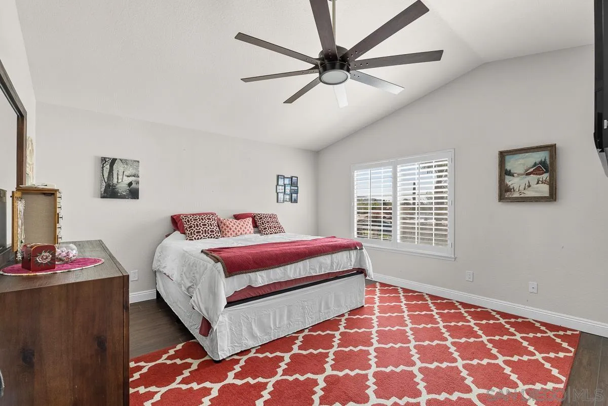 10109 Country Scenes Court Santee, CA 92071 - Photo 26 of 43 a bedroom with a bed and wooden floor