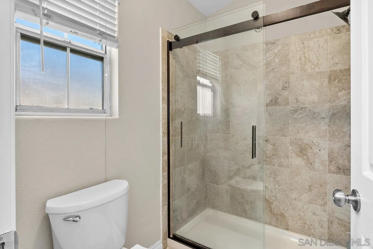 10109 Country Scenes Court Santee, CA 92071 - Photo 29 of 43 a bathroom with a shower and a toilet