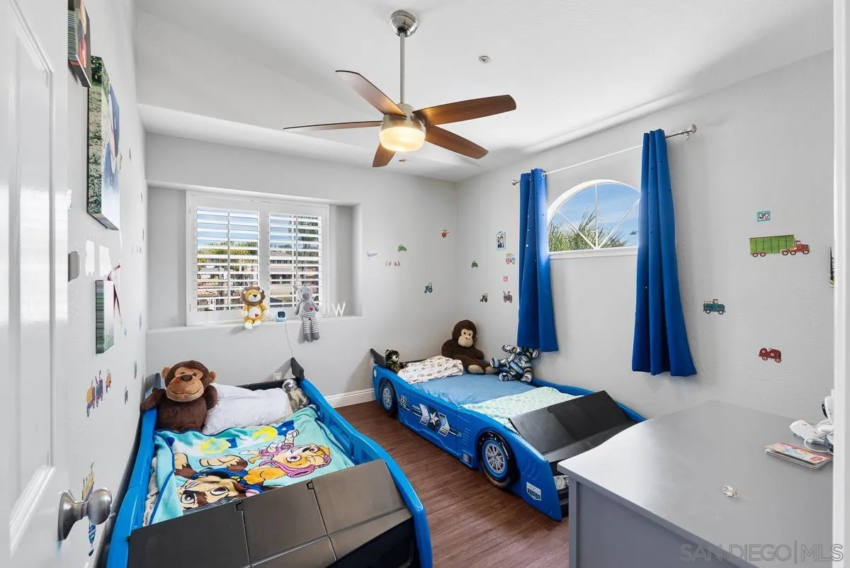 10109 Country Scenes Court Santee, CA 92071 - Photo 35 of 43 a bedroom with a bed and a table