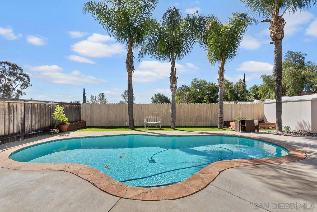 10109 Country Scenes Court Santee, CA 92071 - Photo 38 of 43 a view of a swimming pool with a yard and palm trees