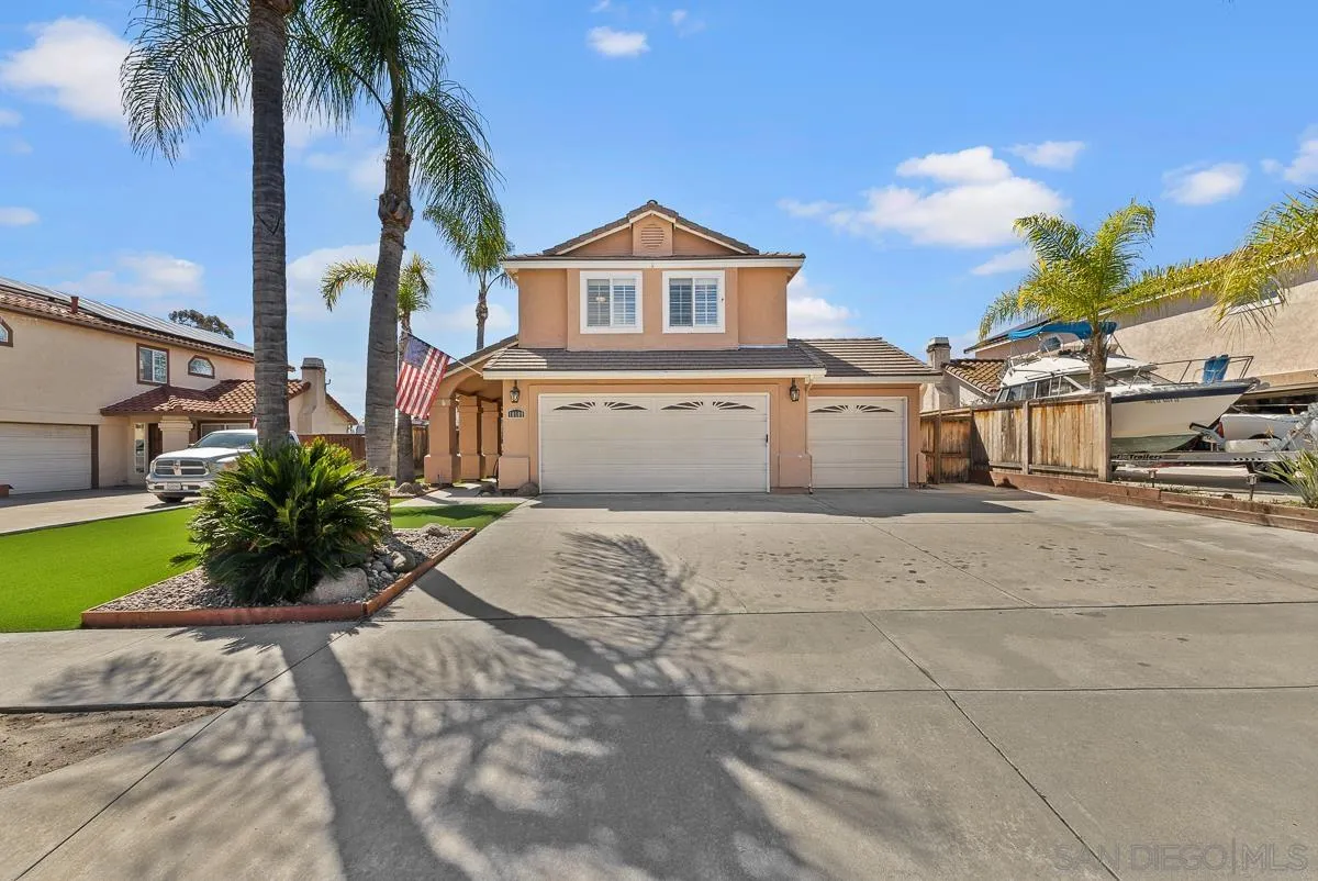 10109 Country Scenes Court Santee, CA 92071 - Photo 4 of 43 a front view of a house with a yard and garage