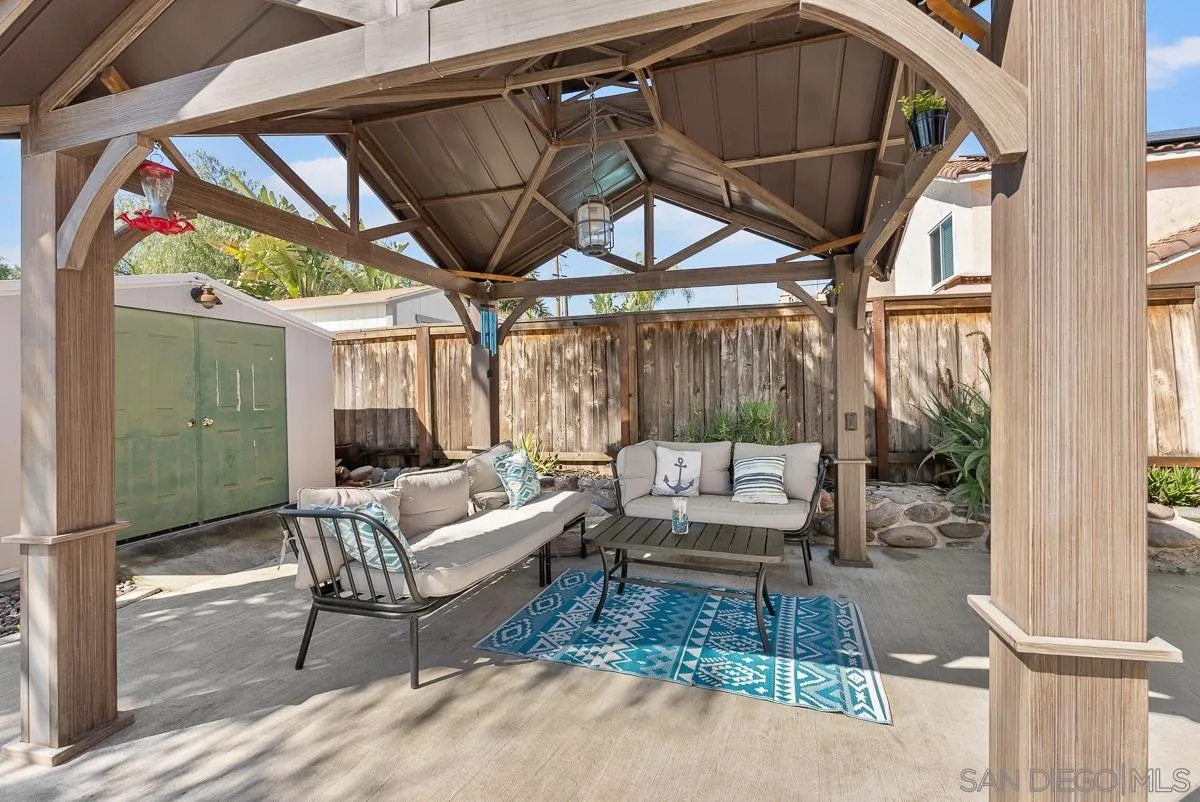 10109 Country Scenes Court Santee, CA 92071 - Photo 41 of 43 a view of a patio with a table and chairs under an umbrella