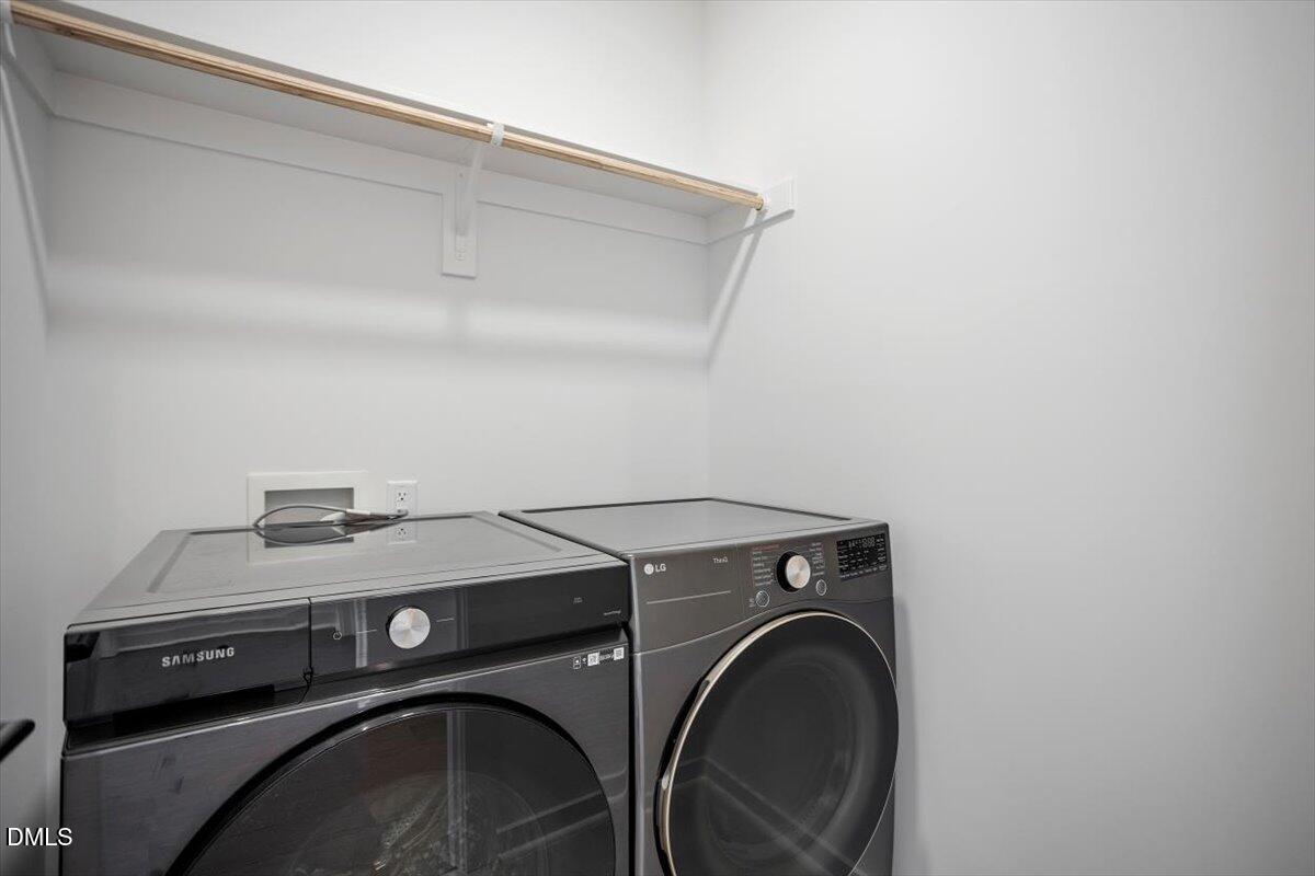 6419 Tanner Oak Lane Raleigh, NC 27613 - Photo 36 of 39 a utility room with dryer and washer