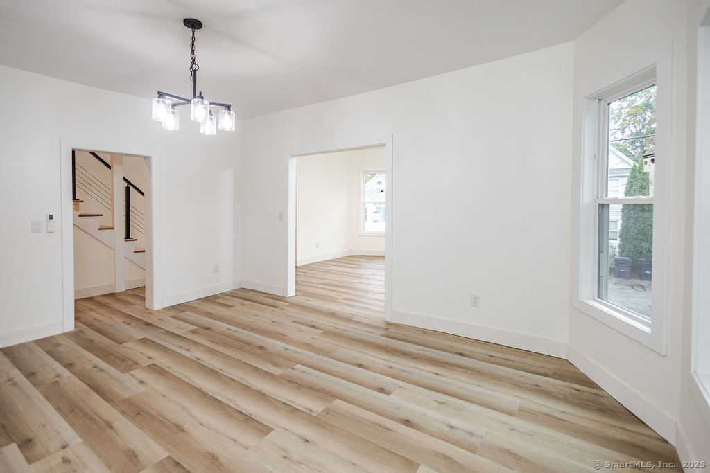 7 Florence Street Putnam, CT 06260 - Photo 19 of 38 a view of empty room with wooden floor and ceiling fan