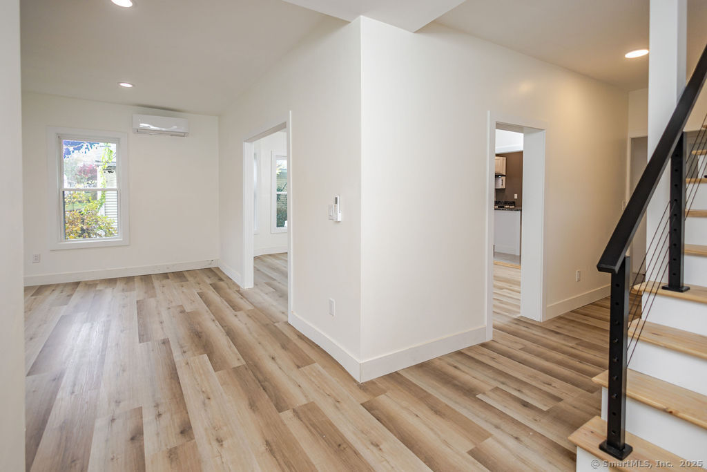 7 Florence Street Putnam, CT 06260 - Photo 21 of 38 a view of a hallway with wooden floor and staircase