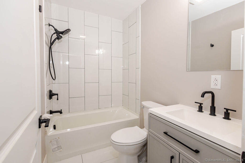 7 Florence Street Putnam, CT 06260 - Photo 25 of 38 a bathroom with a sink a toilet and a bathtub