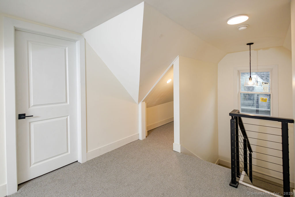 7 Florence Street Putnam, CT 06260 - Photo 31 of 38 a view of a hallway with furniture and a window