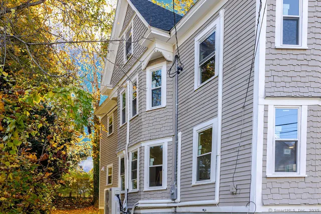 a view of a building with a tree