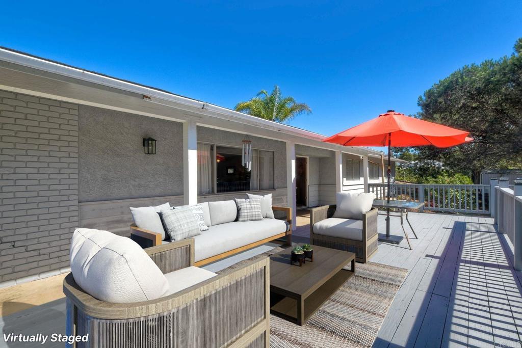 a view of a patio with couches and pool