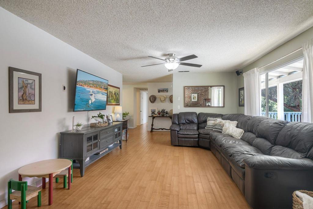 554 Taylor Street Vista, CA 92084 - Photo 14 of 51 a living room with furniture and a flat screen tv
