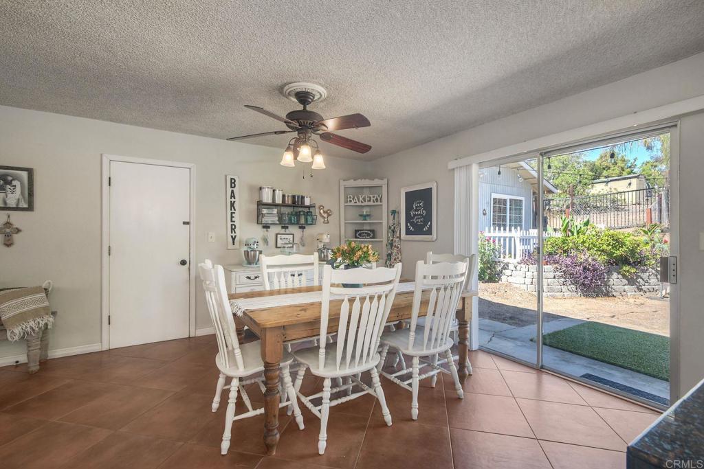 554 Taylor Street Vista, CA 92084 - Photo 16 of 51 a view of a dining room with furniture window and outside view