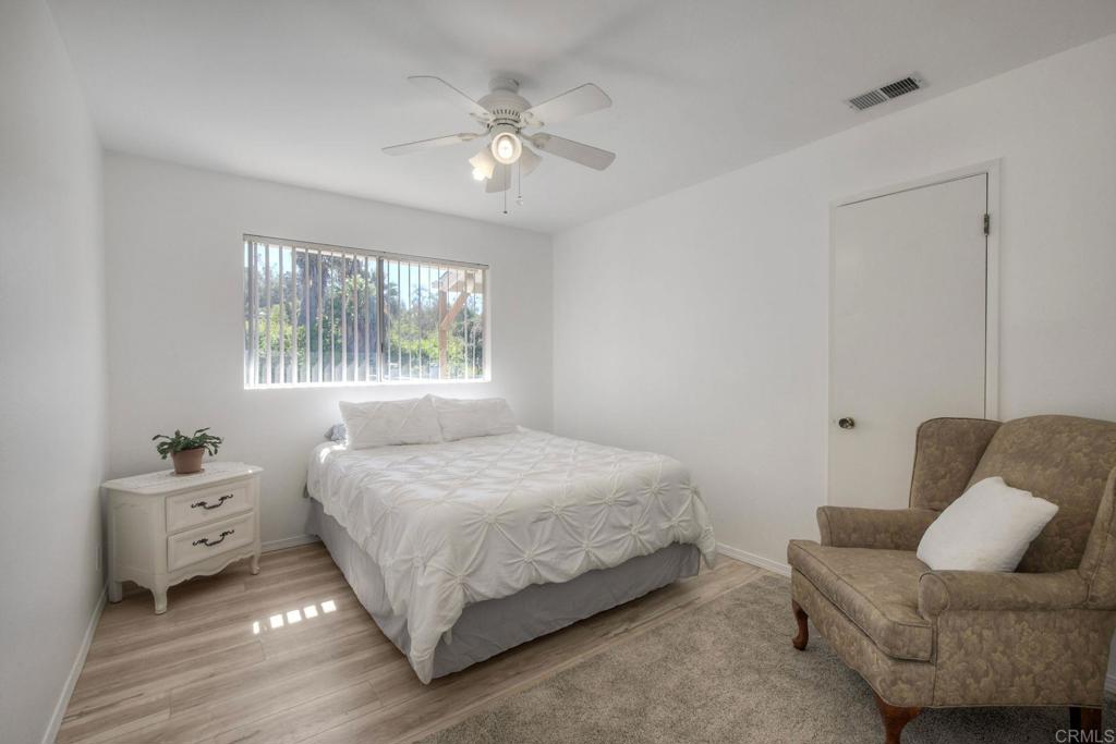 554 Taylor Street Vista, CA 92084 - Photo 22 of 51 a bedroom with a bed and a couch