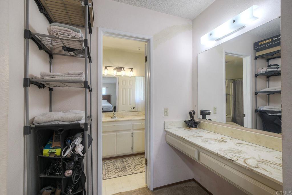554 Taylor Street Vista, CA 92084 - Photo 26 of 51 a bathroom with a granite countertop sink a toilet and shower