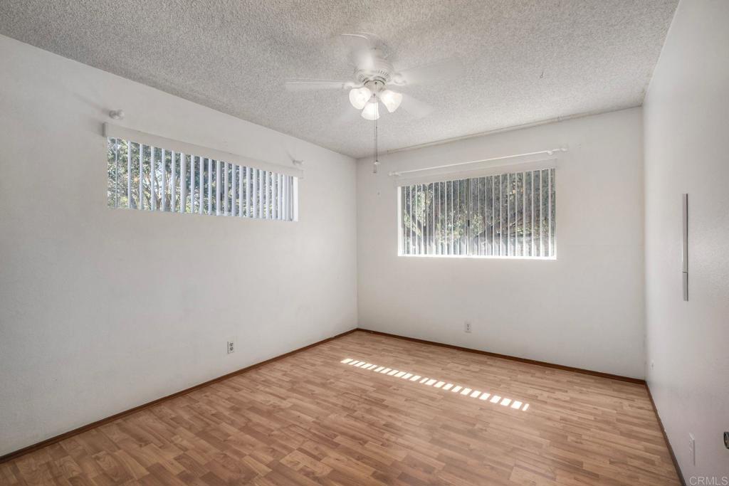 554 Taylor Street Vista, CA 92084 - Photo 28 of 51 a view of an empty room with chandelier fan and fire place