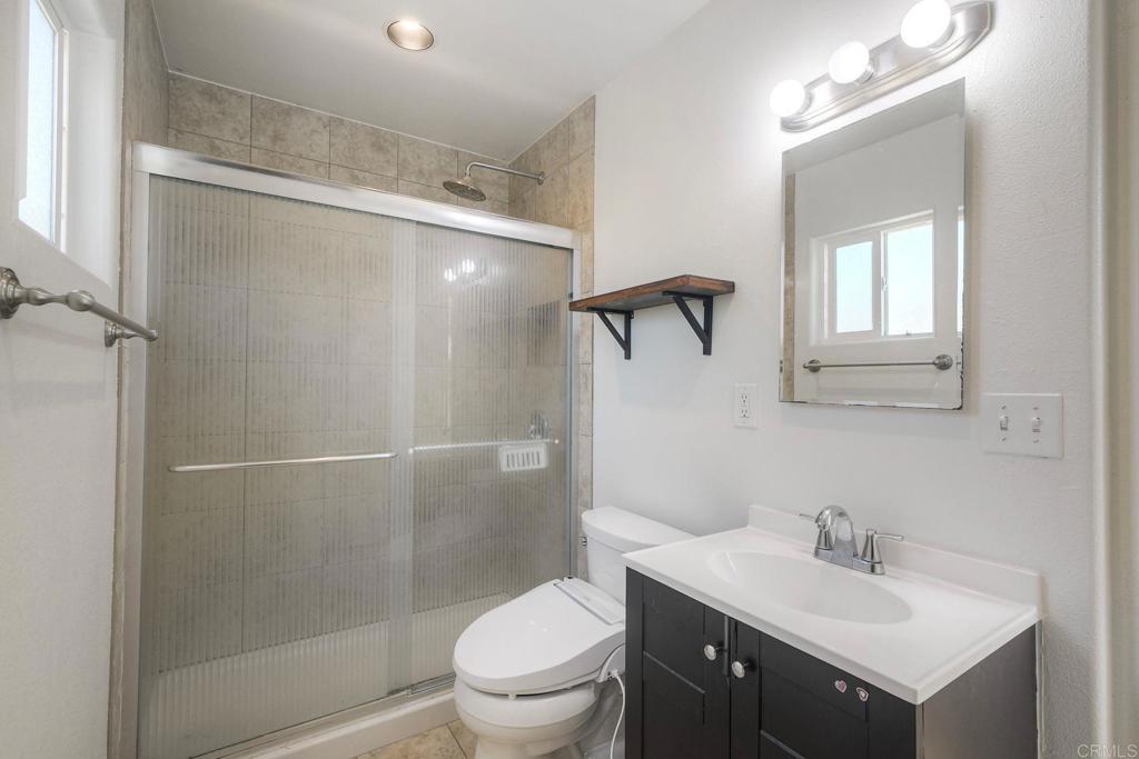 554 Taylor Street Vista, CA 92084 - Photo 42 of 51 a bathroom with a sink toilet and shower