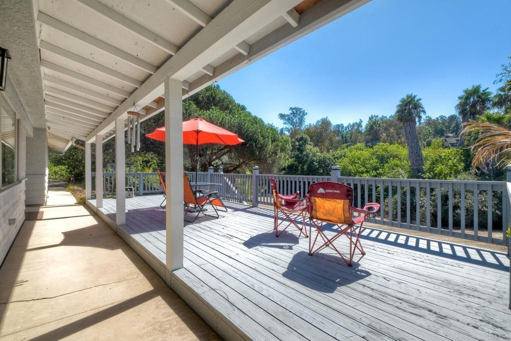 554 Taylor Street Vista, CA 92084 - Photo 48 of 51 a view of a deck with wooden floor and outdoor seating