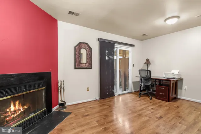 a view of a livingroom with furniture and a fireplace