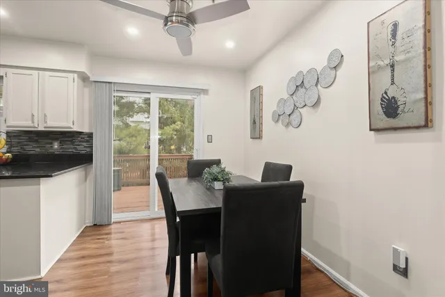 a view of a dining room with furniture and a window