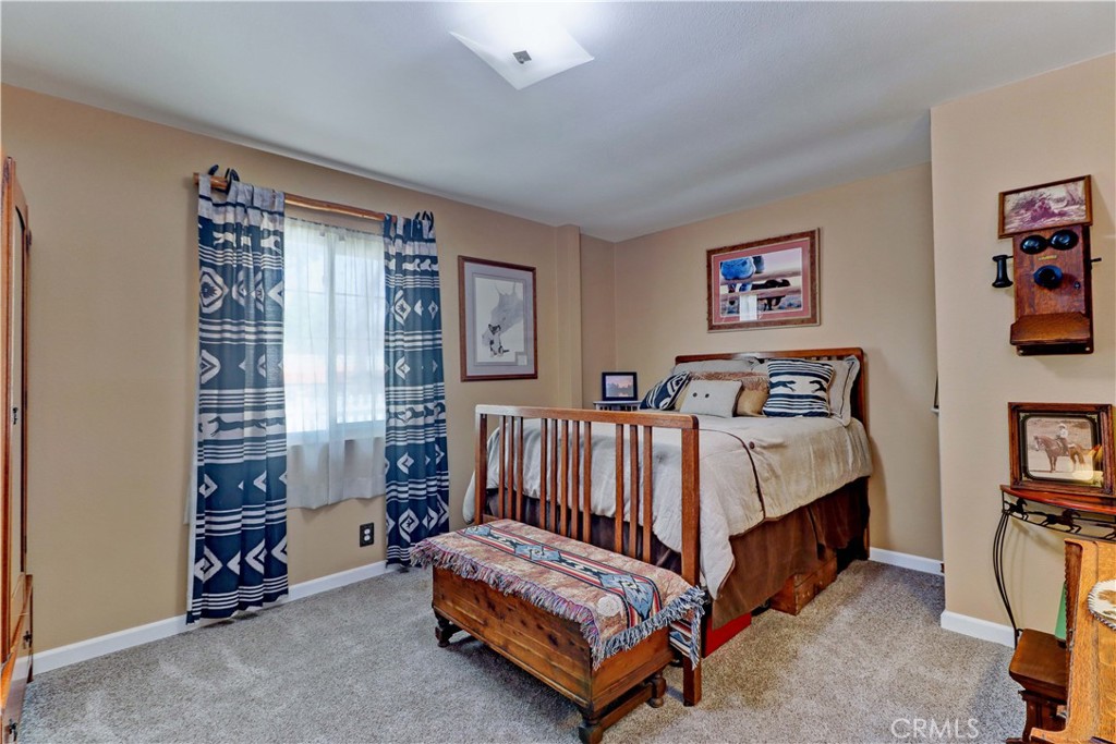 31895 Nicolas Road Temecula, CA 92591 - Photo 12 of 37 a bed room with a bed and a chair
