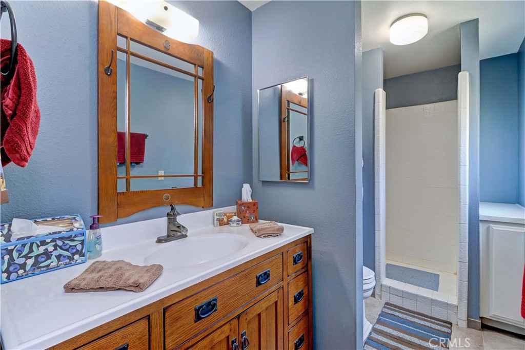 31895 Nicolas Road Temecula, CA 92591 - Photo 8 of 37 a bathroom with a sink and a mirror