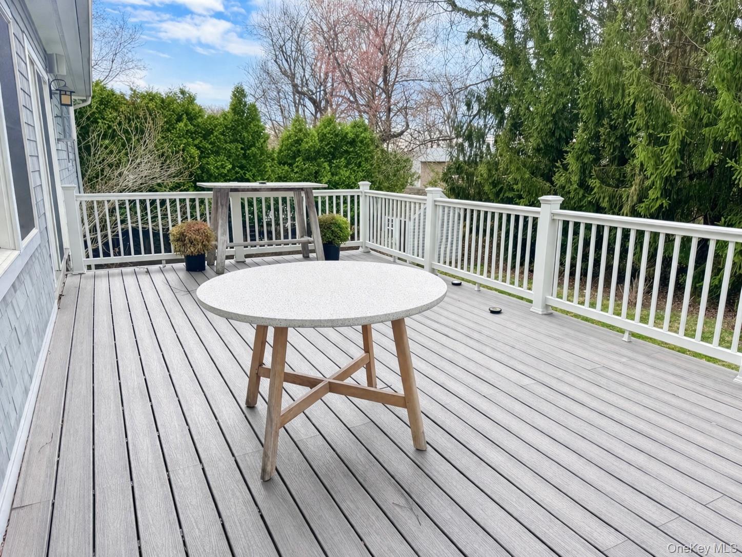 225 South Barry Avenue, Unit RENT Mamaroneck, NY 10543 - Photo 11 of 26 a view of a wooden deck with furniture