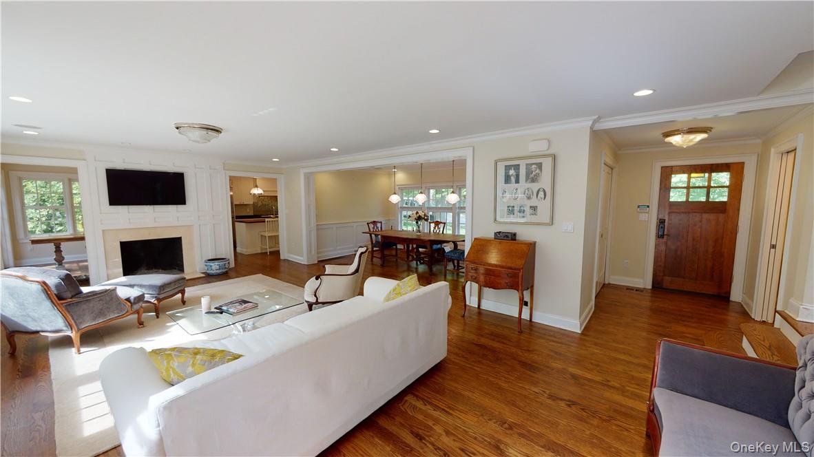 225 South Barry Avenue, Unit RENT Mamaroneck, NY 10543 - Photo 3 of 26 a living room with furniture a fireplace and a flat screen tv