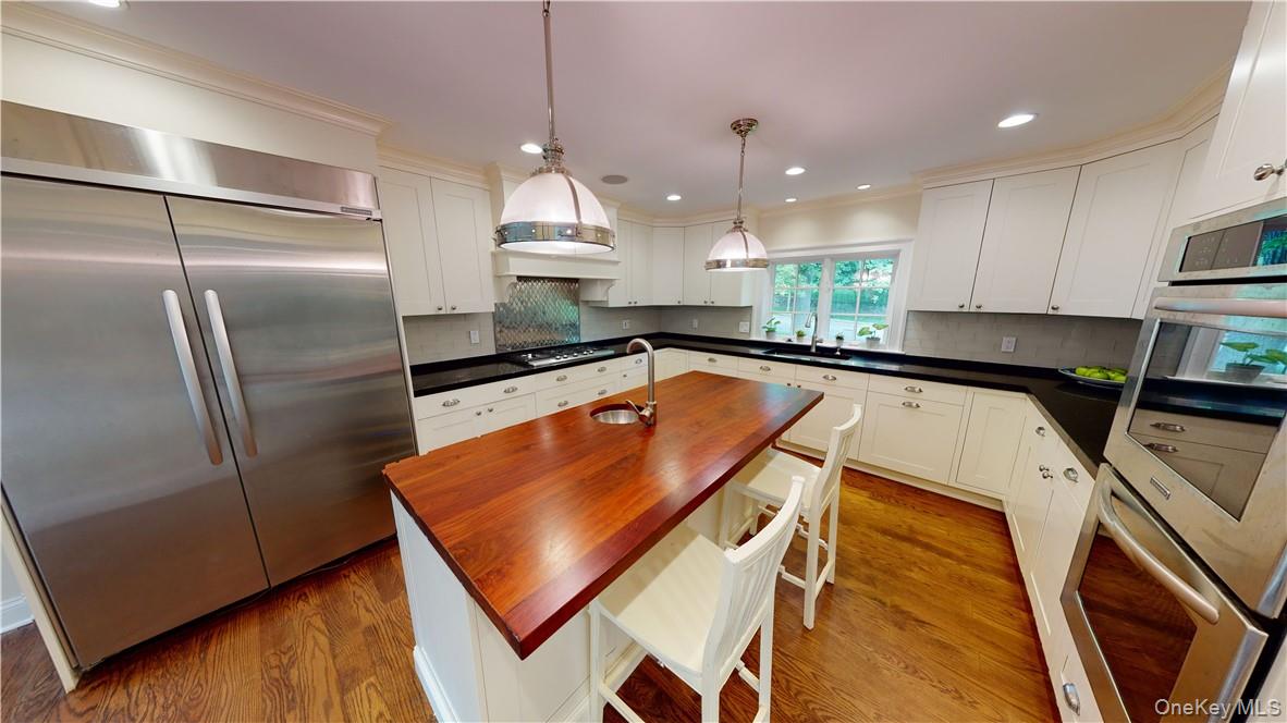 225 South Barry Avenue, Unit RENT Mamaroneck, NY 10543 - Photo 7 of 26 a kitchen with stainless steel appliances granite countertop a refrigerator a sink and a stove