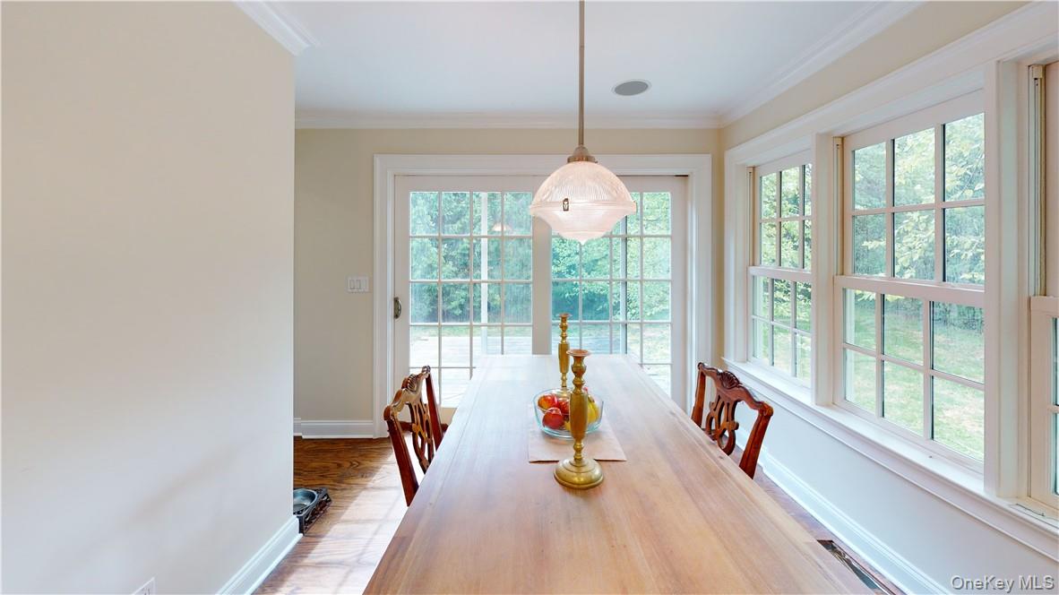 225 South Barry Avenue, Unit RENT Mamaroneck, NY 10543 - Photo 9 of 26 a view of a dining room with furniture wooden floor and chandelier