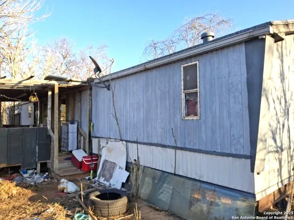 a backyard of a house with seating space