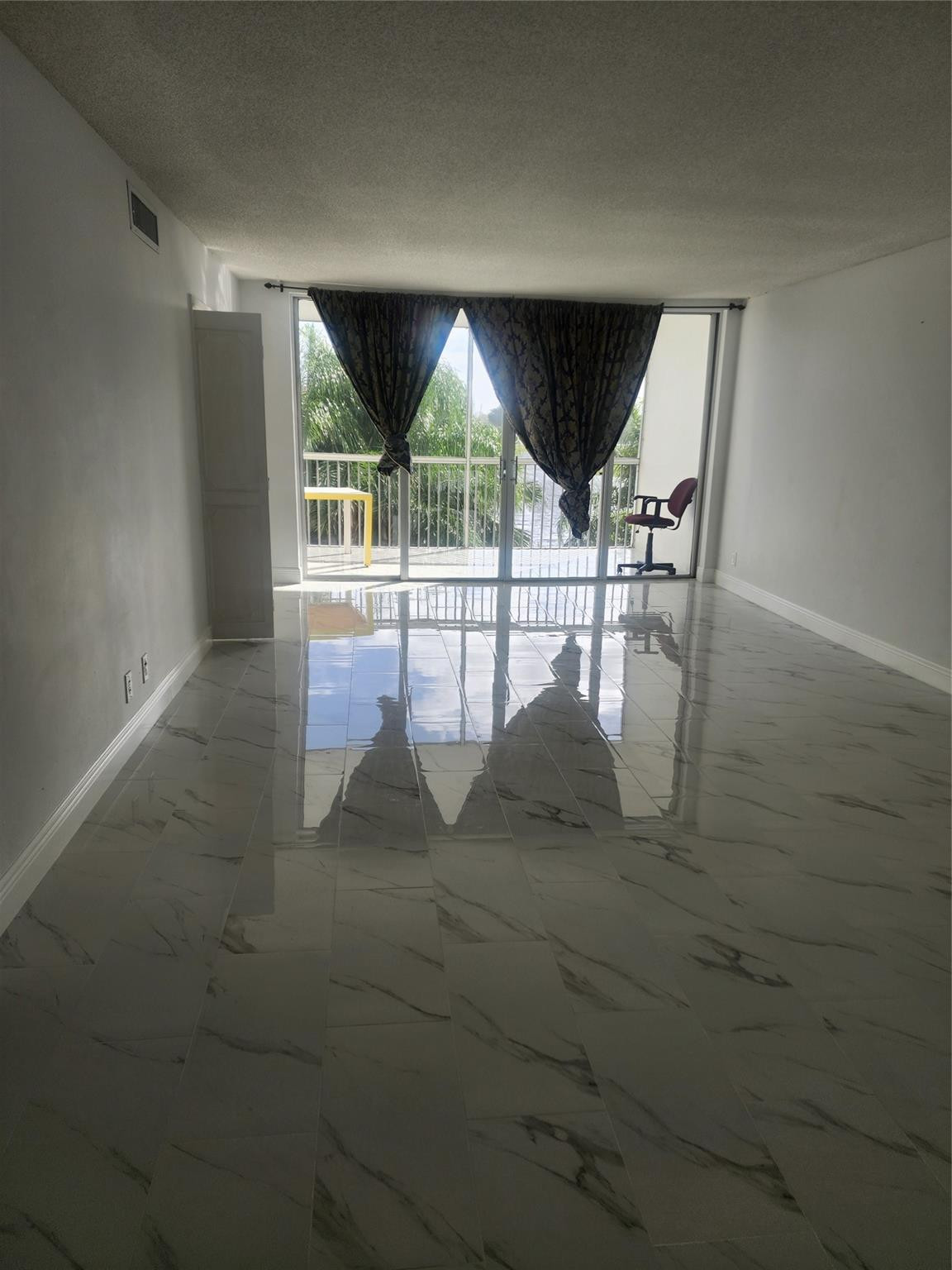 3051 North Course Drive Pompano Beach, FL 33069 - Photo 1 of 13 a view of workspace with wooden floor and window