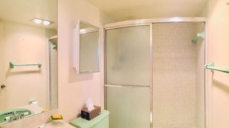 3051 North Course Drive Pompano Beach, FL 33069 - Photo 11 of 13 a bathroom with a shower and a sink