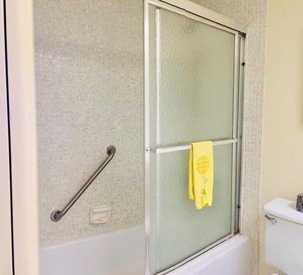 3051 North Course Drive Pompano Beach, FL 33069 - Photo 12 of 13 a bathroom with a shower
