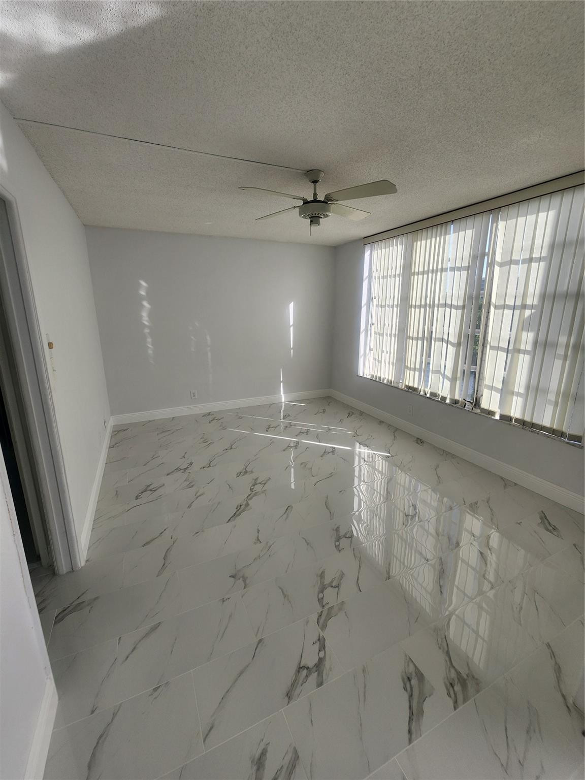3051 North Course Drive Pompano Beach, FL 33069 - Photo 10 of 13 a view of an empty room and a window